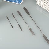 Double-ended spatula with an angular/rounded tip, made of stainless steel